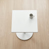 Top view of a Modern Marble-Style Side Table with a small cup on its surface.