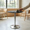 Adjustable Height Bar Table with Metal Round Top in modern dining space with coffee and chairs