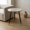 Coffee Table MDF Covered with White Finish: Elegant coffee table with a marble top and gold accents, placed beside a modern sofa.