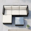 4 Piece Modular PE Rattan Outdoor Sectional Sofa with Coffee Table in an outdoor setting on a patio.