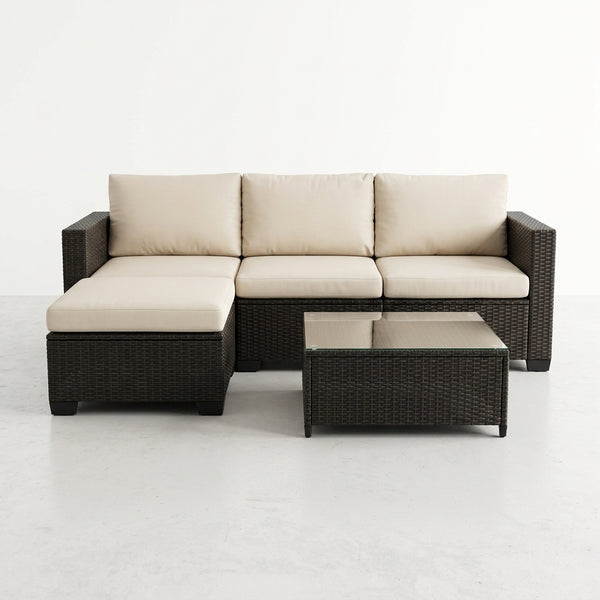 4 Piece Modular PE Rattan Outdoor Sectional Sofa with Coffee Table featuring soft cushions and a sleek design.