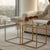Metal Nesting Table with Glass Top showcasing modern design in a stylish living area.