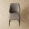 Modern Faux Leather Dining Chair with Channel-Tufted Back on herringbone floor