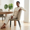 Modern Faux Leather Dining Chair with Channel-Tufted Back in a stylish dining room setting.