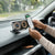Electric Flexible Wireless Car Charger Mount in use, featuring a phone mounted for navigation and wireless charging.