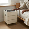 Smart Modern Simple Eco-Friendly Bedside Table with charging feature, stylish design, and storage next to a bed.