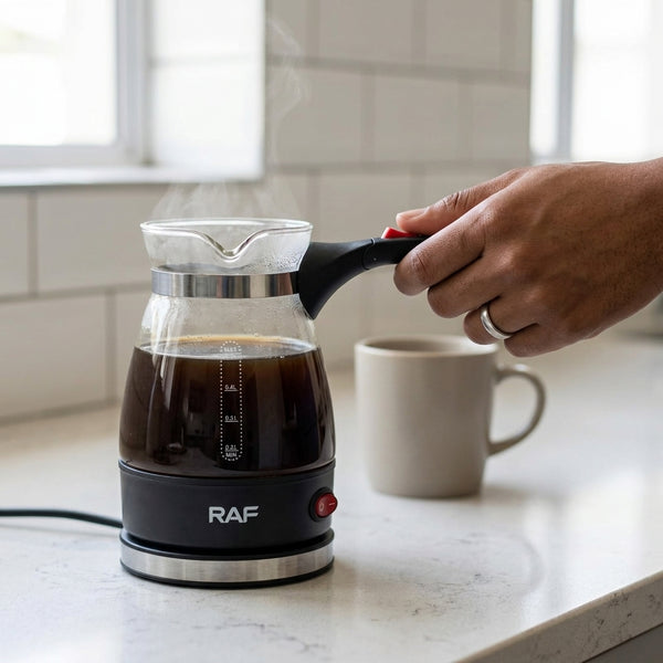 Electric Turkish Coffee Maker with Glass Pot brewing coffee on a kitchen countertop with a steaming glass pot.