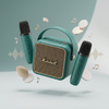 Mini Karaoke Amplifier with Microphones in teal, featuring two microphones and music notes.