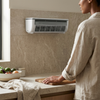 Air Cooling Mist Fan mounted on a kitchen wall providing airflow and cooling for a comfortable cooking environment.