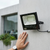 Image of a 60W Solar Floodlight installed on a wall, providing bright outdoor illumination.