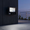 25W Solar Floodlight mounted on exterior wall providing bright outdoor illumination at dusk.