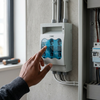 Person using a 3-Pole Fuse Switch Disconnector 160A to isolate electrical circuits in a distribution setup.