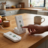 Wireless Call Button Pager Set with Charging Docks on kitchen counter with one unit being activated.