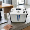 12-24V Portable Diesel Heater on a table next to a laptop and coffee cup, showcasing its user-friendly interface.