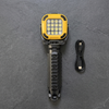 Portable LED Work Light with Adjustable Tripod Stand displayed on a slate background with charging cable.