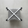 Collapsible Laundry Basket with Wheels on a tiled floor, showing its wheeled frame and compact design for easy storage.