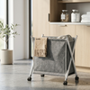 Collapsible Laundry Basket with Wheels displayed in a modern interior, filled with laundry and conveniently on wheels.