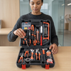 100-Piece Hand Tool Set with Storage Case displayed by a person, showcasing organized hand tools in a black case.