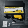 Electric Demolition Hammer with Chisels and Carry Case in its packaging and accessories on a gray surface.