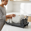 2-Tier Kitchen Dish Drying Rack with Utensil Holder being used for drying plates and utensils in a modern kitchen.