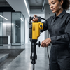 Electric Demolition Hammer with Chisels and Carry Case being used in a modern interior space.