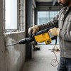 Electric Demolition Hammer with Chisels and Carry Case in use for concrete breaking.