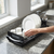 2-Tier Kitchen Dish Drying Rack with Utensil Holder with plates and cups on kitchen counter.