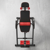 Adjustable Inversion Table for Home Fitness with padded backrest and ankle restraints.