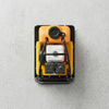 Top view of a petrol-powered flat plate compactor with an orange engine and black handle.
