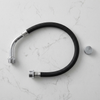 Flexible Braided Hose Assembly with threaded metal fittings on a marble background.