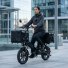 Woman riding a 16-Inch Electric Delivery Cargo Bike with cargo baskets in an urban setting.