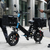 16-Inch Electric Delivery Cargo Bike with black carrying bags, ideal for efficient deliveries on city streets.