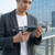 Remote Controlled Foldable Drone held by a man outdoors, showcasing its compact design and four-propeller layout.
