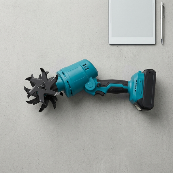 Cordless Handheld Garden Cultivator on a flat surface beside a tablet and pen.
