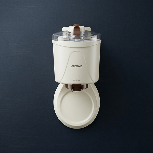 Compact Ice Cream Machine with a sleek design and transparent lid, perfect for homemade frozen desserts.