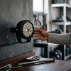 LED Wall Light mounted on a wall with a person adjusting its position in a workshop setting.