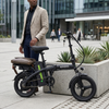 Compact Electric Bicycle parked next to a planter, featuring a compact frame and a rear rack.