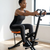 Woman using an Adjustable Folding Fitness Exercise Machine in a home workout space.