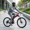 Person riding a VoltTrail Electric Cycling Bike in a modern urban setting.
