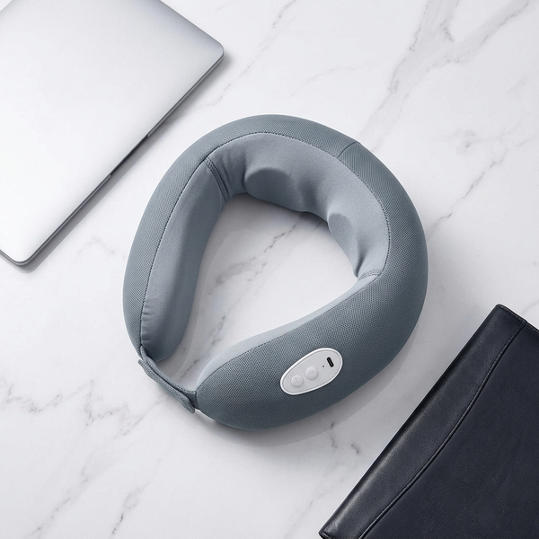 Wearable Neck Massager in gray color on marble surface, featuring integrated controls for easy operation.