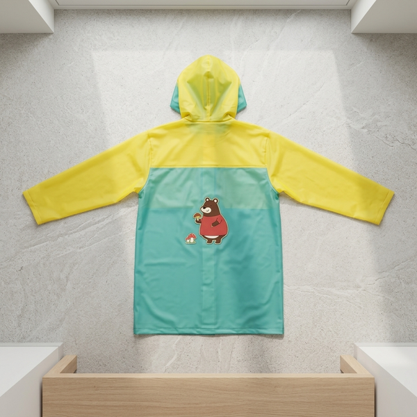 Childrens Hooded Raincoat featuring a colorful design with a bear character and a hood for rainy weather protection.