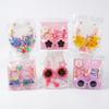 Childrens Hair Accessories & Sunglasses Set featuring colorful designs and playful accessories for kids.