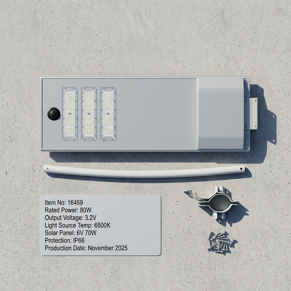 80W Solar Street Light with specifications and accessories on a concrete surface.