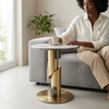 Round Pedestal Side Table beside a woman sitting on a sofa, showcasing its modern design and practical use.