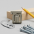 Anti-Theft Security Bracket with installation hardware, including screws and washers, on a wooden surface.