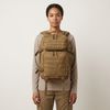 Tactical Coyote Brown Rucksack shown on a model highlighting its multi-compartment and outdoor design.