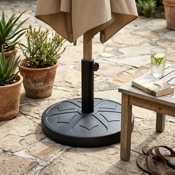 Round Outdoor Umbrella Base with Adjustable Pole Holder supporting an umbrella in an outdoor setting.
