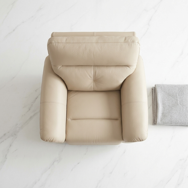 Top view of a beige recliner chair from a 3-Piece Reclining Sofa Set beside a gray throw blanket.