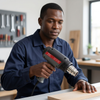 Heat Gun in use by a professional, demonstrating its heating capability for various workshop applications.