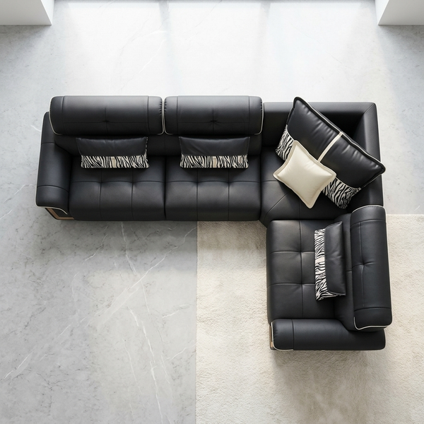 L-Shaped Sectional Sofa with black cushions and decorative pillows in a modern living room setting.